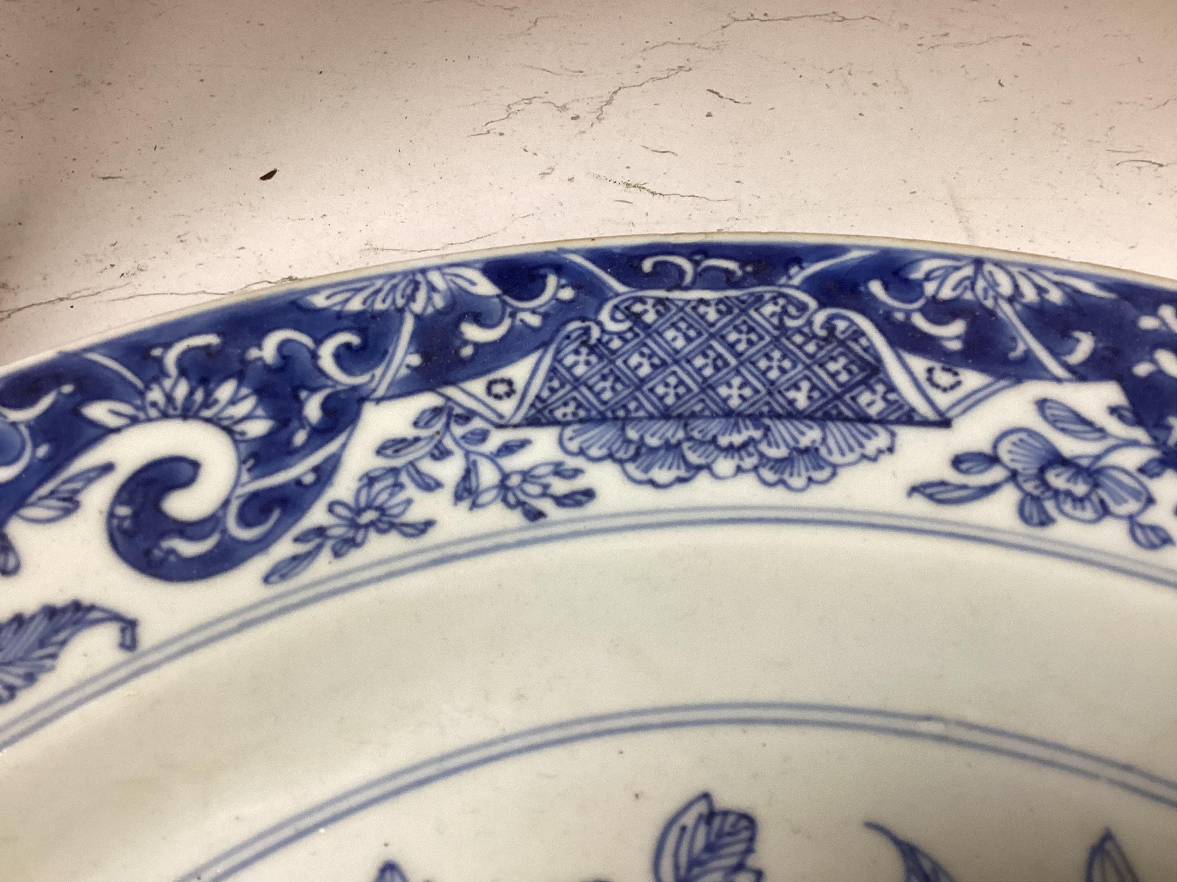 A Worcester teapot, c.1770, an 18th century Chinese famille rose and a blue and white dish, a small blue and white dish, a cup and saucer and teapot, largest dish 39cm (7). Condition - most damaged, cracked or chipped